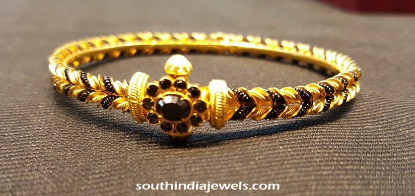 22k gold bangle with black stones and beads