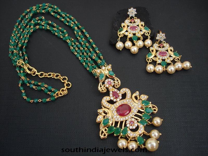 Imitation emerald mala with emerald pearl earrings from Magha Store