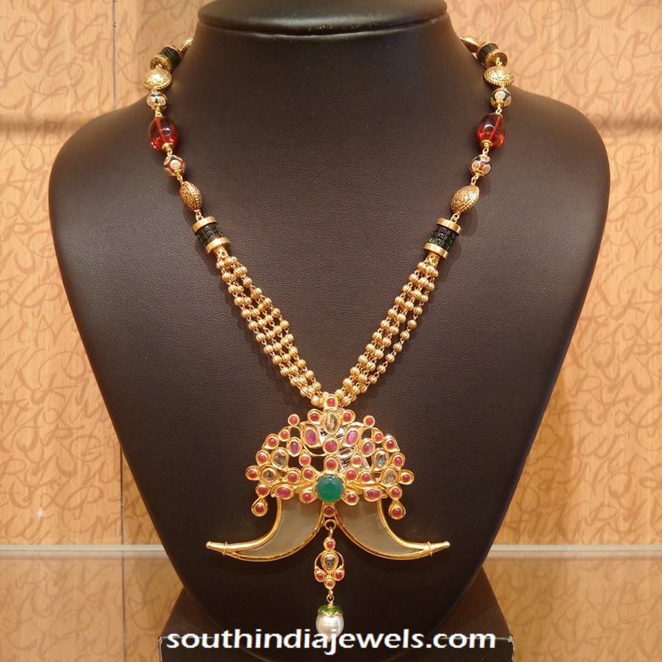 Gold Necklace with elephant tusk pendant