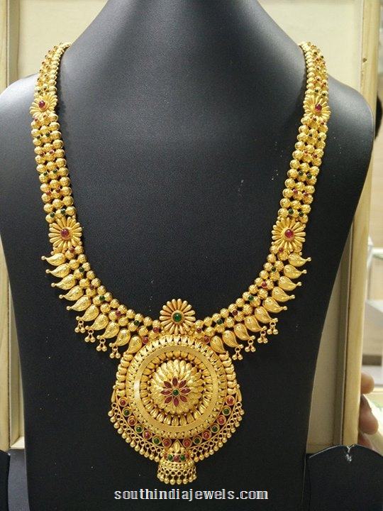 Gold long haram with floral pendant