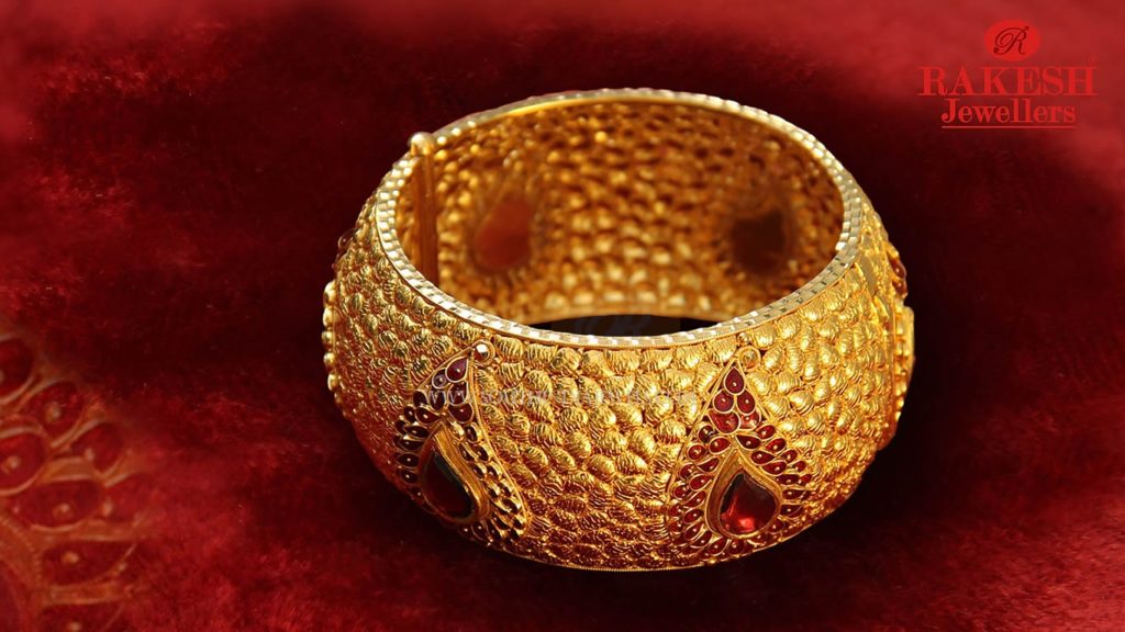 Bold Gold Bangle With Red Stones