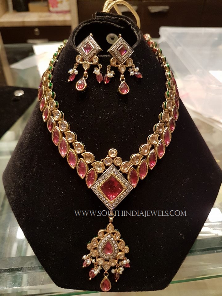 22 carat gold broad and intricate ruby necklace and matching earrings from  Premraj Shantilal Je…