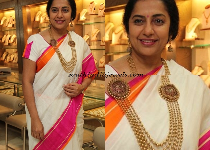Suhasini in multilayer gold long necklace