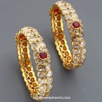 Gold bangles with precious stones