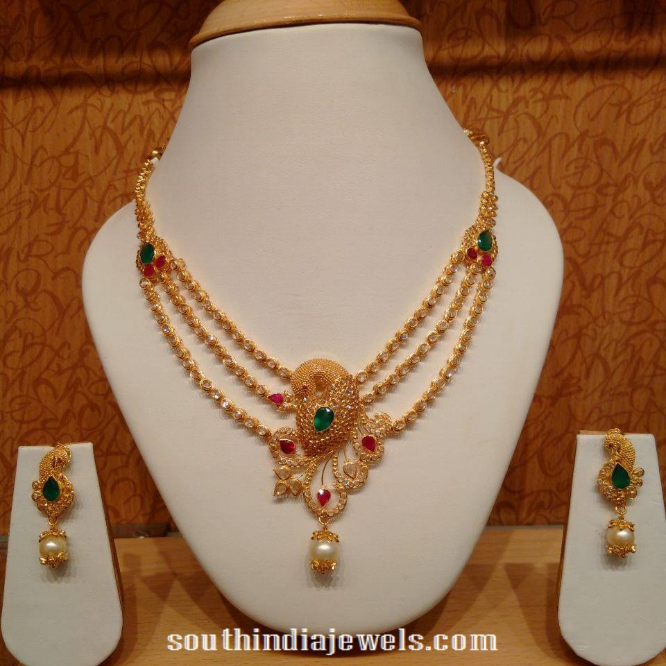 Three layer gold peacock necklace with earrings
