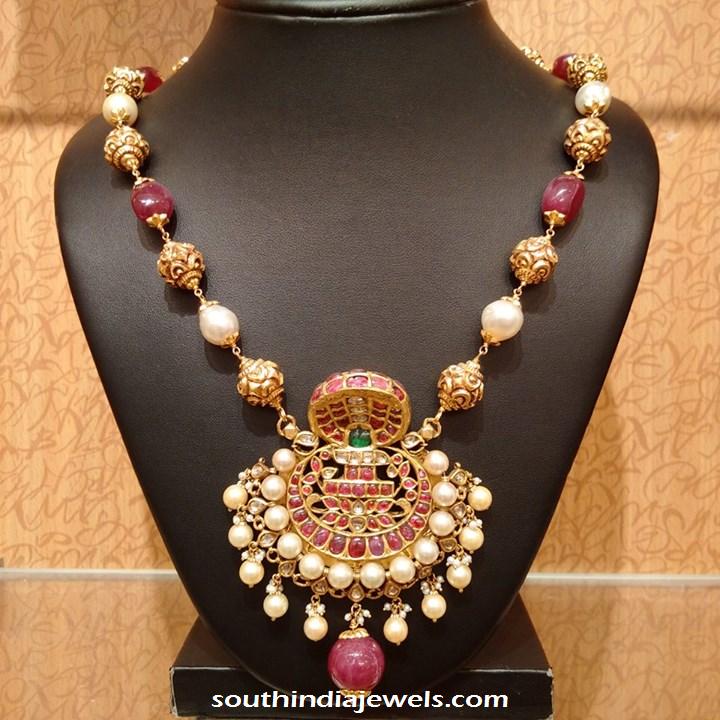 Gold ruby pearl necklace with antique naga pendant