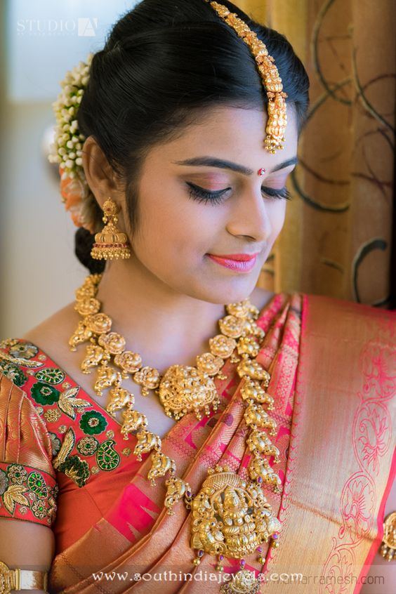 Indian bride with gold temple wedding jewellery