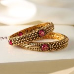 Gold Bangles with Pink Stones from Manubhai