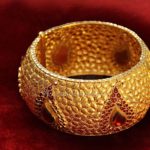 Bold Gold Bangle With Red Stones